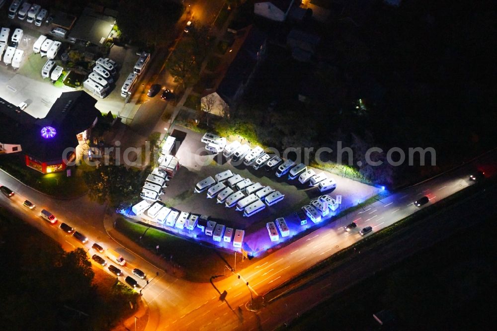 Hoppegarten at night from above - Night lighting parking and storage space for automobiles Caravan Center Matner in the district Dahlwitz-Hoppegarten in Hoppegarten in the state Brandenburg, Germany