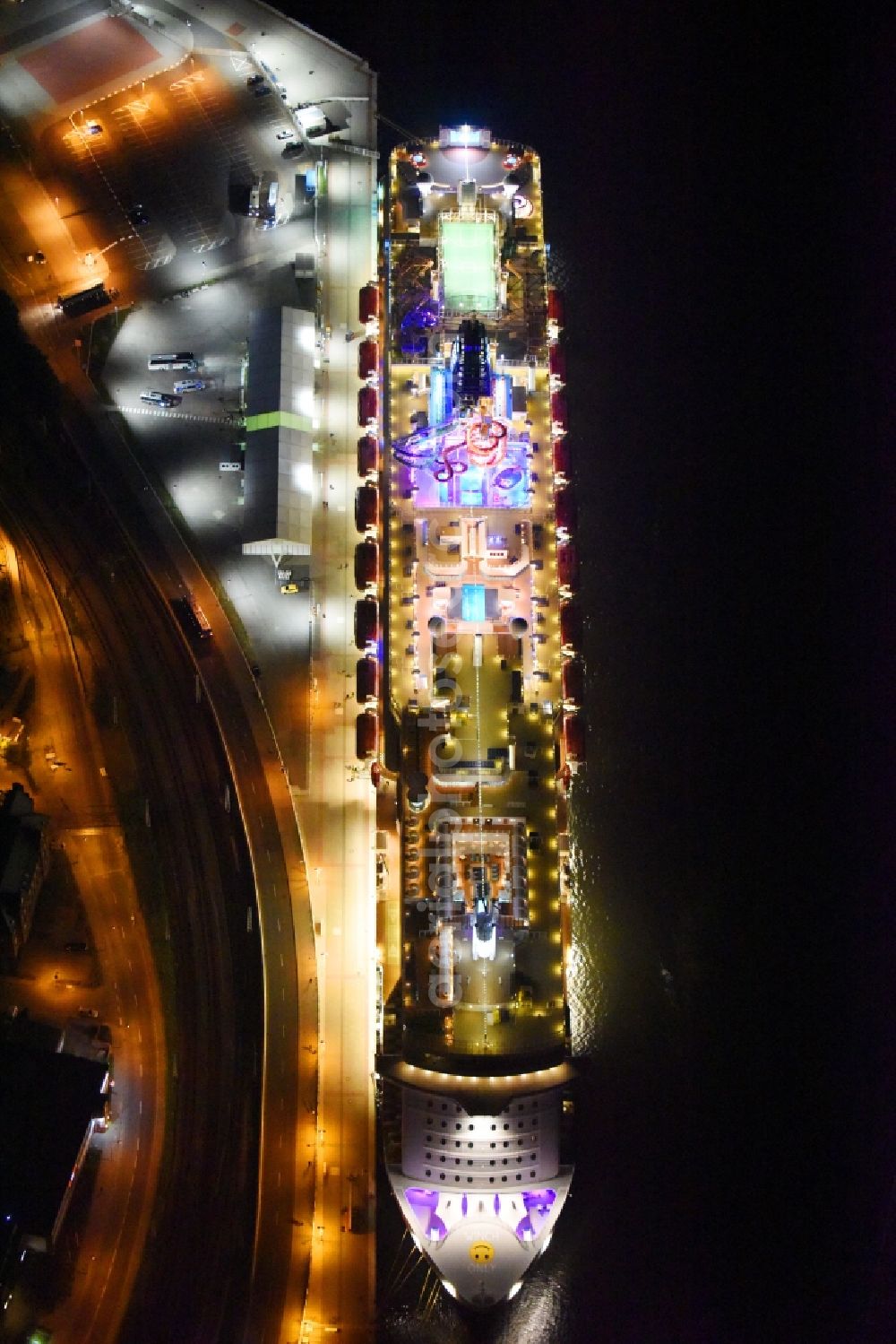 Aerial photograph at night Rostock - Night lighting Passenger ship Norwegian Getaway in the district Warnemuende in Rostock in the state Mecklenburg - Western Pomerania, Germany