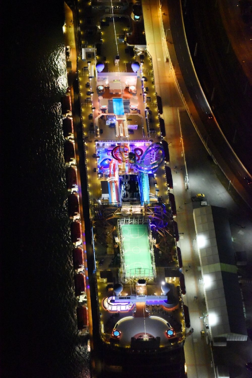 Aerial image at night Rostock - Night lighting Passenger ship Norwegian Getaway in the district Warnemuende in Rostock in the state Mecklenburg - Western Pomerania, Germany