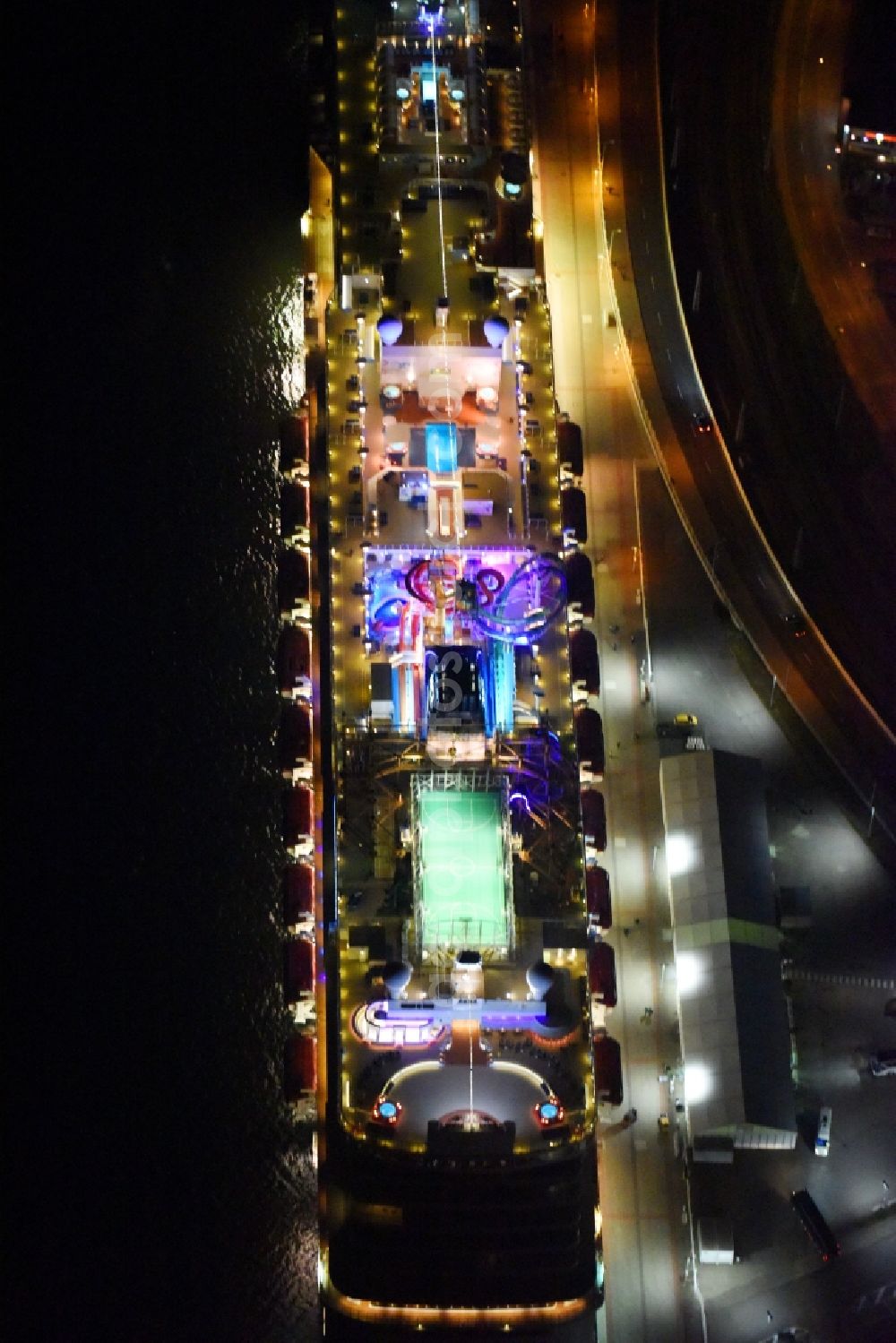 Rostock at night from above - Night lighting Passenger ship Norwegian Getaway in the district Warnemuende in Rostock in the state Mecklenburg - Western Pomerania, Germany