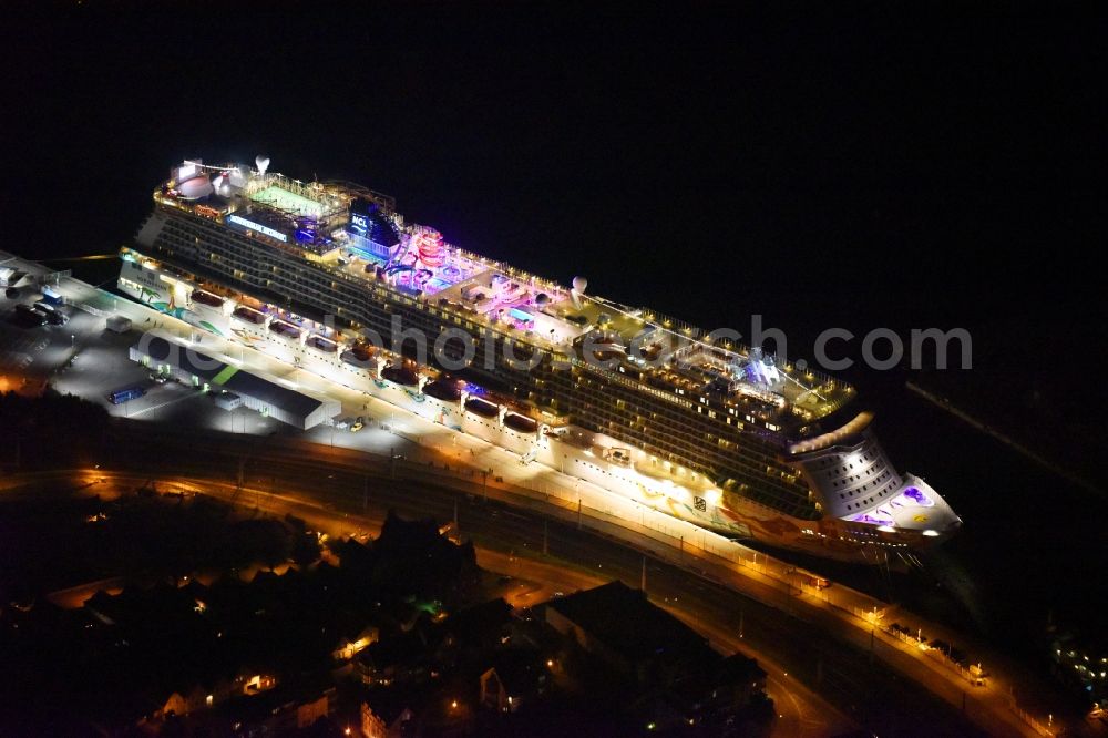 Aerial photograph at night Rostock - Night lighting Passenger ship Norwegian Getaway in the district Warnemuende in Rostock in the state Mecklenburg - Western Pomerania, Germany