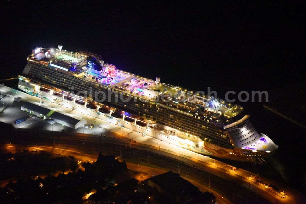 Aerial image at night Rostock - Night lighting Passenger ship Norwegian Getaway in the district Warnemuende in Rostock in the state Mecklenburg - Western Pomerania, Germany