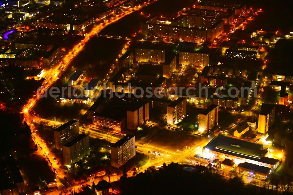 Aerial photograph at night Berlin - Night lighting skyscrapers in the residential area of industrially manufactured settlement along the Walter-Friedrich-Strasse - Franz-Schmidt-Strasse in Berlin, Germany