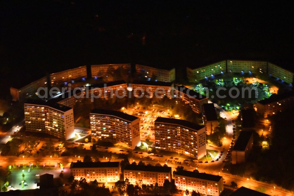 Aerial photograph at night Neubrandenburg - Night lighting Skyscrapers in the residential area of industrially manufactured settlement Salvador-Allende-Strasse - Semmelweissstrasse in Neubrandenburg in the state Mecklenburg - Western Pomerania, Germany