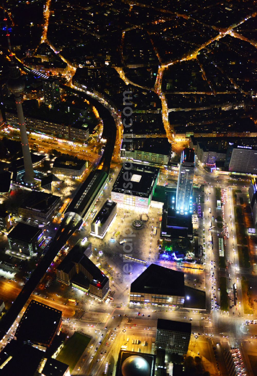 Berlin at night from the bird perspective: Night lights and lighting square ensemble at Alexanderplatz station - Berlin TV tower in the city center in the Mitte district in Berlin, Germany