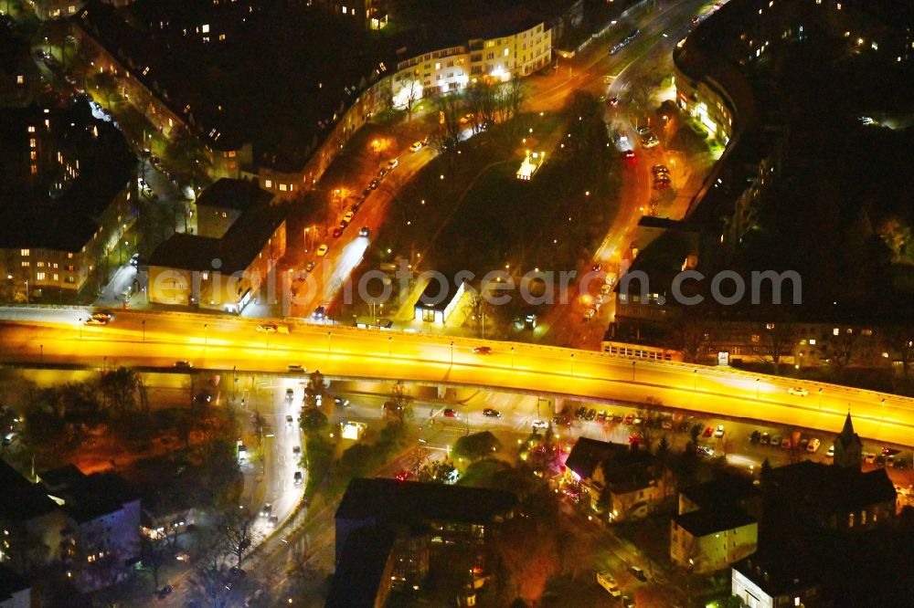 Aerial photograph at night Berlin - Night lighting Ensemble space Breitenbachplatz on Schorlemerallee in the inner city center in the district Dahlem in Berlin, Germany