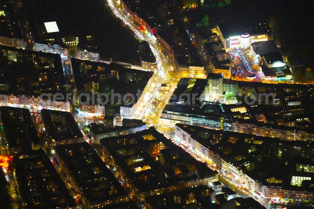 Aerial image at night Berlin - Night lighting Ensemble space Hermannplatz in the inner city center in the district Neukoelln in Berlin, Germany