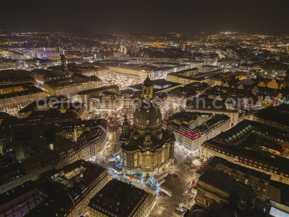 Dresden at night from the bird perspective: Night lights and illumination of the Neumarkt square ensemble with Frauenkirche and Christmas market in the city center in the Altstadt district of Dresden in the state of Saxony, Germany