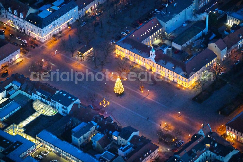 Aerial image at night Neuruppin - Night lighting Ensemble space Schulplatz in the inner city center in Neuruppin in the state Brandenburg, Germany