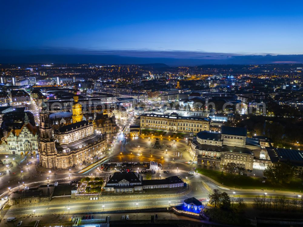 Dresden at night from the bird perspective: Night lighting ensemble space an place Theaterplatz with memorial Koenig-Johann-Denkmal and thater Semperoper in the inner city center in the district Altstadt in Dresden in the state Saxony, Germany