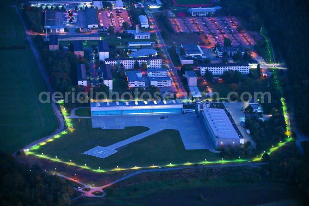 Aerial photograph at night Ahrensfelde - Night lighting Helicopter landing pad - airfield for helicopters of the Federal Police Aviation Squadron Blumberg on Neuer Schwanebecker Weg in the district of Blumberg in Ahrensfelde in the federal state of Brandenburg