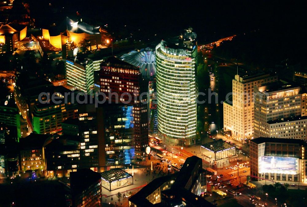 Aerial photograph at night Berlin - Place Potsdamer Platz Berlin at night in Berlin - Mitte. In many brilliant colors Potsdamer Platz Berlin at night during the action Berlin in lights