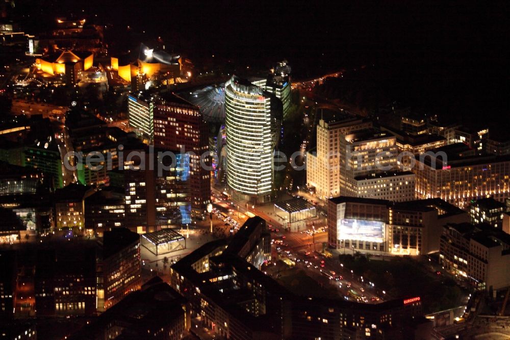 Aerial image at night Berlin - Place Potsdamer Platz Berlin at night in Berlin - Mitte. In many brilliant colors Potsdamer Platz Berlin at night during the action Berlin in lights