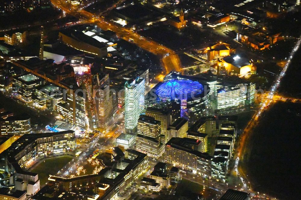 Berlin at night from the bird perspective: Night lighting Ensemble space Potsdamer Platz and Leipziger Platz in the inner city center in Berlin in Germany