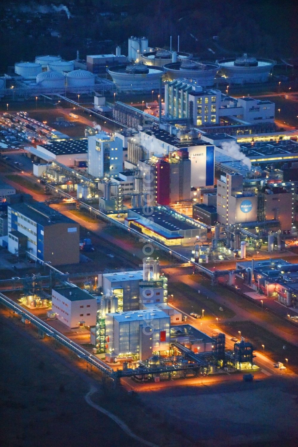 Bitterfeld-Wolfen at night from above - Night lighting Refinery equipment and management systems on the factory premises of the chemical manufacturers of Bayer Bitterfeld GmbH in Chemiepark in the district Greppin in Bitterfeld-Wolfen in the state Saxony-Anhalt