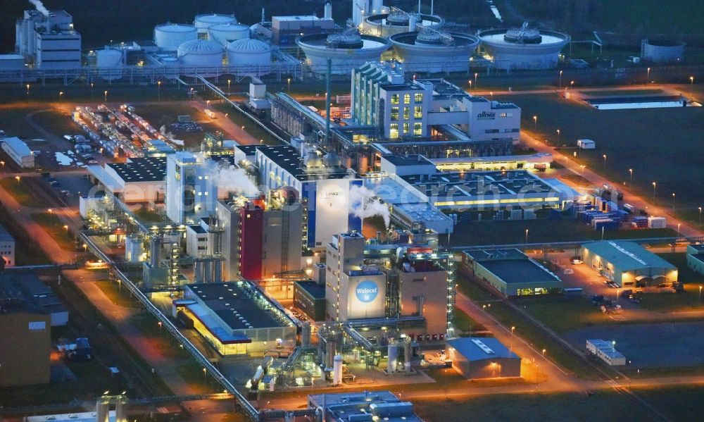 Bitterfeld-Wolfen at night from above - Night lighting Refinery equipment and management systems on the factory premises of the chemical manufacturers of Bayer Bitterfeld GmbH in Chemiepark in the district Greppin in Bitterfeld-Wolfen in the state Saxony-Anhalt