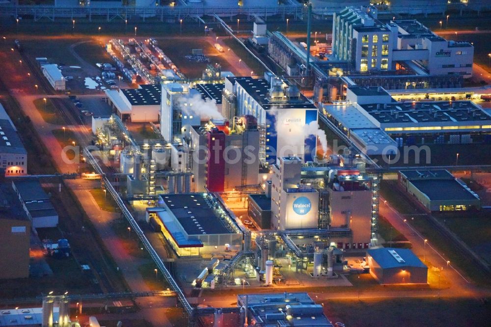 Aerial image at night Bitterfeld-Wolfen - Night lighting Refinery equipment and management systems on the factory premises of the chemical manufacturers of Bayer Bitterfeld GmbH in Chemiepark in the district Greppin in Bitterfeld-Wolfen in the state Saxony-Anhalt