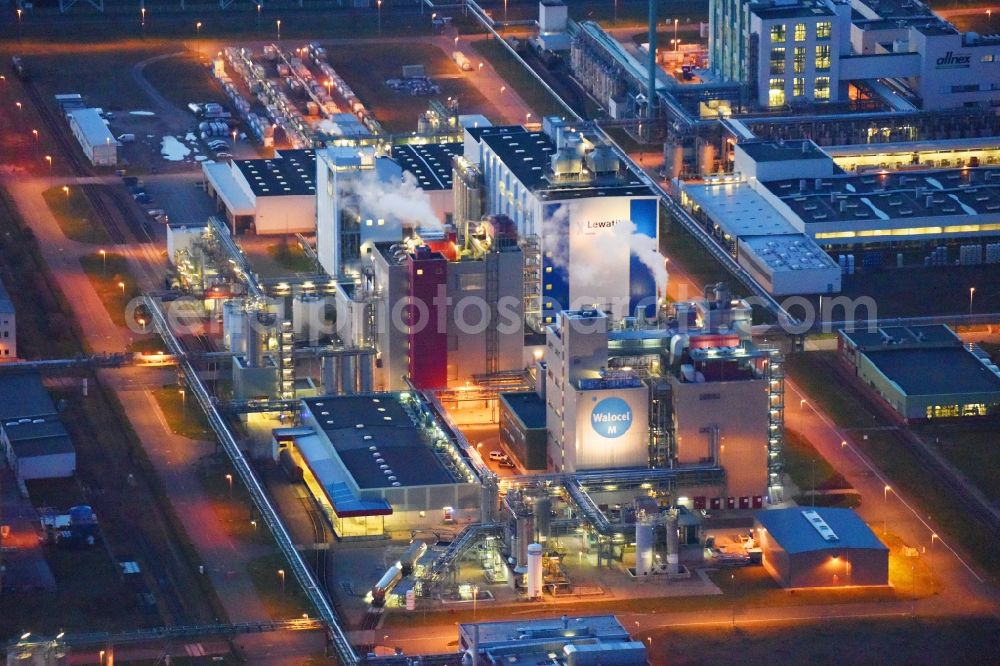 Bitterfeld-Wolfen at night from above - Night lighting Refinery equipment and management systems on the factory premises of the chemical manufacturers of Bayer Bitterfeld GmbH in Chemiepark in the district Greppin in Bitterfeld-Wolfen in the state Saxony-Anhalt