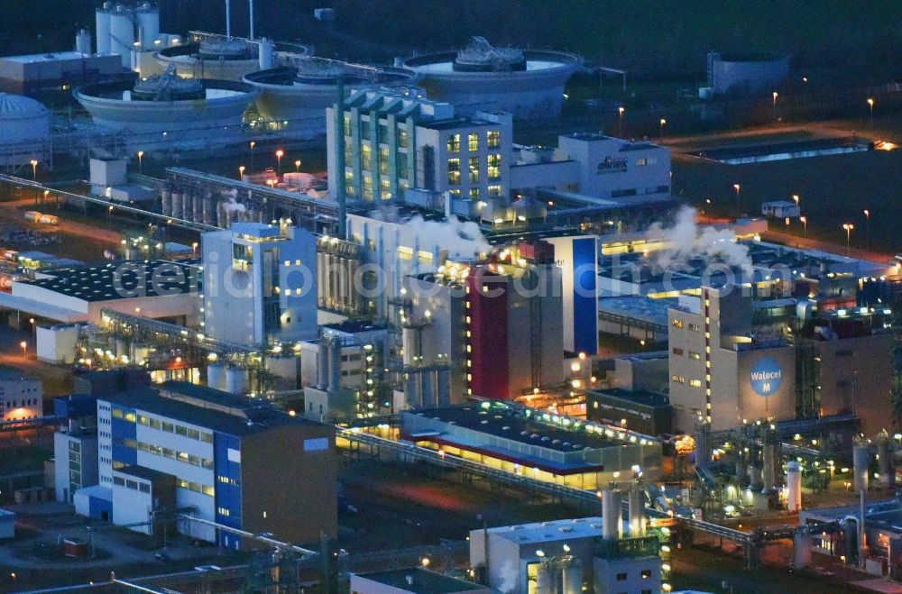 Aerial photograph at night Bitterfeld-Wolfen - Night lighting Refinery equipment and management systems on the factory premises of the chemical manufacturers of Bayer Bitterfeld GmbH in Chemiepark in the district Greppin in Bitterfeld-Wolfen in the state Saxony-Anhalt