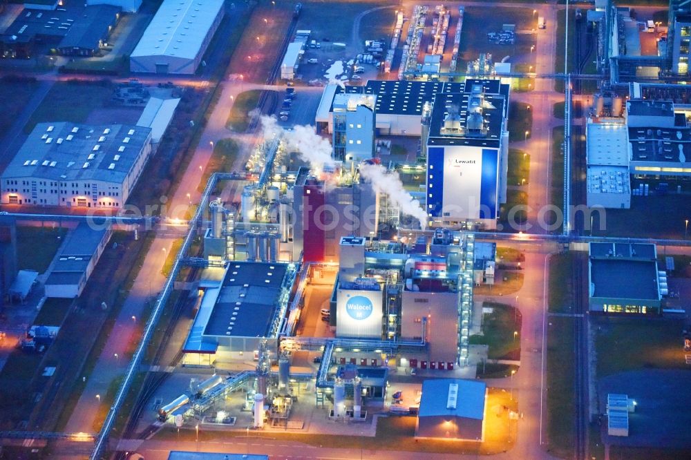 Aerial photograph at night Bitterfeld-Wolfen - Night lighting Refinery equipment and management systems on the factory premises of the chemical manufacturers of Bayer Bitterfeld GmbH in Chemiepark in the district Greppin in Bitterfeld-Wolfen in the state Saxony-Anhalt