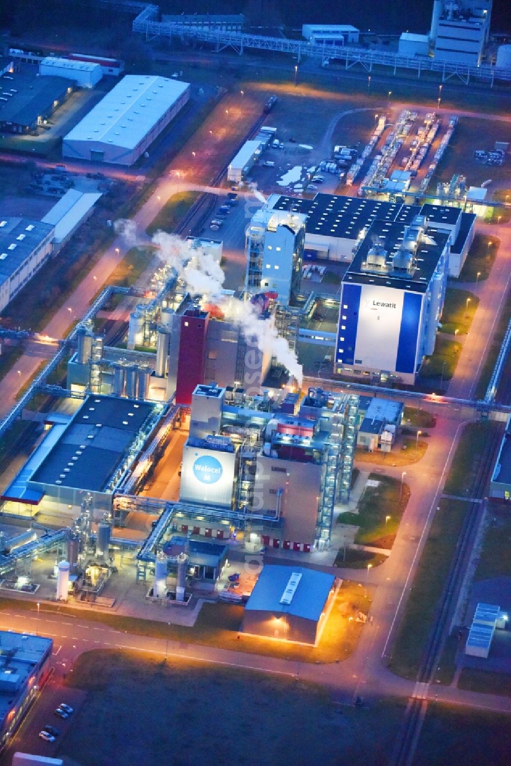 Bitterfeld-Wolfen at night from above - Night lighting Refinery equipment and management systems on the factory premises of the chemical manufacturers of Bayer Bitterfeld GmbH in Chemiepark in the district Greppin in Bitterfeld-Wolfen in the state Saxony-Anhalt