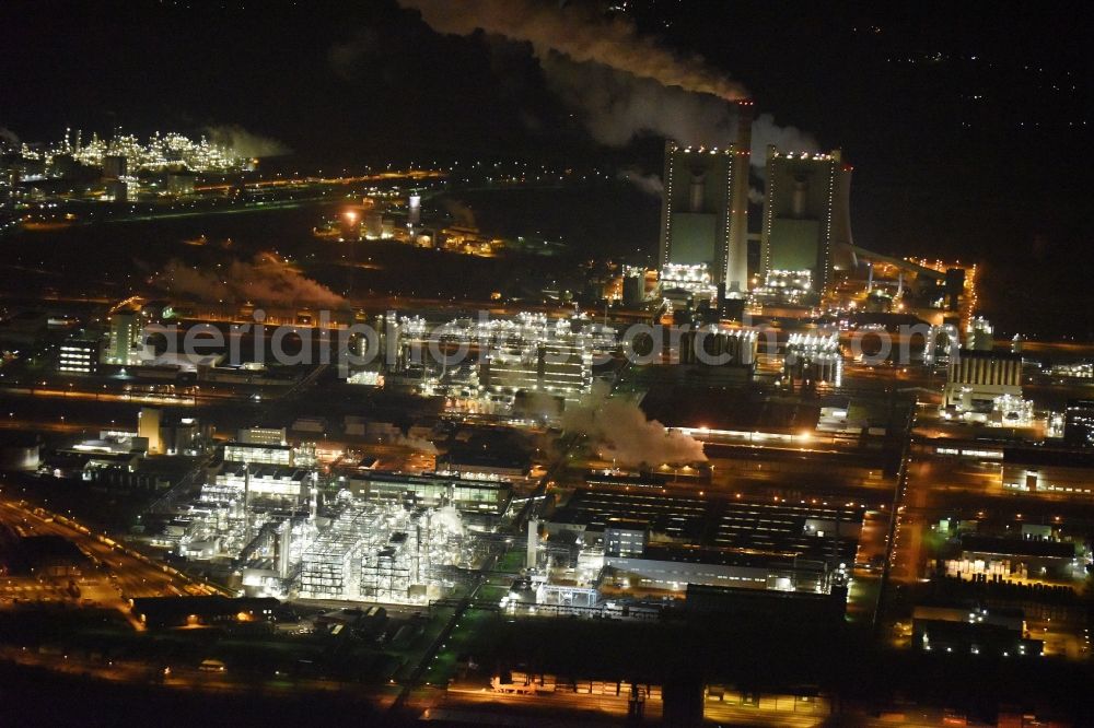 Aerial image at night Schkopau - Night view of Refinery equipment and management systems on the factory premises of the chemical manufacturers Dow Olefinverbund GmbH in Schkopau in the state Saxony-Anhalt