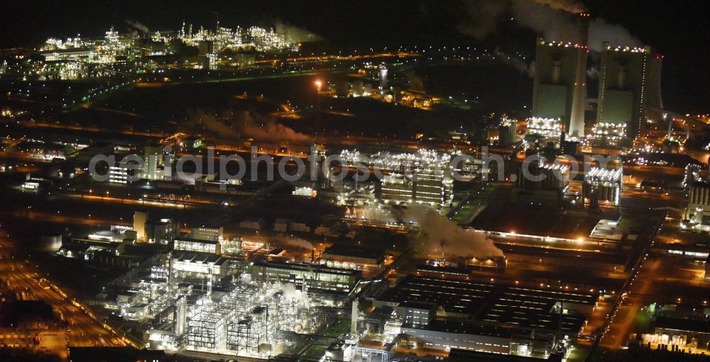 Schkopau at night from above - Night view of Refinery equipment and management systems on the factory premises of the chemical manufacturers Dow Olefinverbund GmbH in Schkopau in the state Saxony-Anhalt