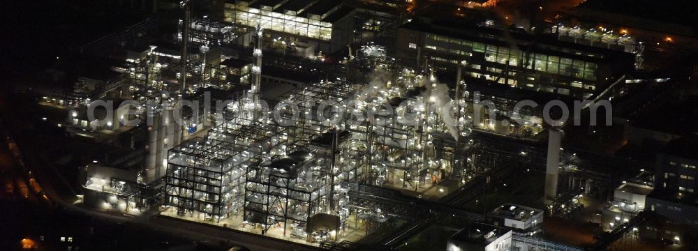 Aerial image at night Schkopau - Night view of Refinery equipment and management systems on the factory premises of the chemical manufacturers Dow Olefinverbund GmbH in Schkopau in the state Saxony-Anhalt