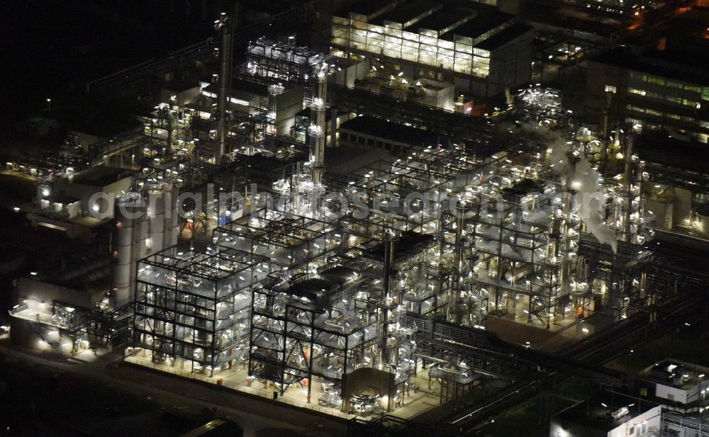 Schkopau at night from above - Night view of Refinery equipment and management systems on the factory premises of the chemical manufacturers Dow Olefinverbund GmbH in Schkopau in the state Saxony-Anhalt