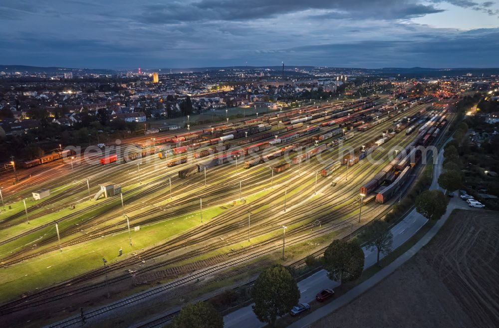 Aerial image at night Kornwestheim - Night lighting marshalling yard and freight station Deutsche Bahn on street Westrandstrasse in Kornwestheim in the state Baden-Wuerttemberg, Germany