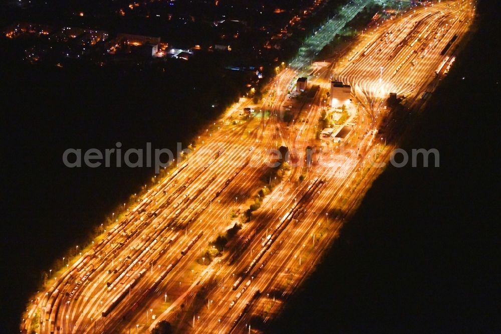 Neuseddin at night from above - Night lighting marshalling yard and freight station of the Deutsche Bahn in Neuseddin in the state Brandenburg