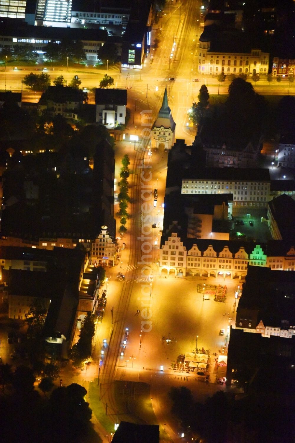 Aerial photograph at night Rostock - Night lighting Town Hall building of the city administration on Neuer Markt in Rostock in the state Mecklenburg - Western Pomerania, Germany