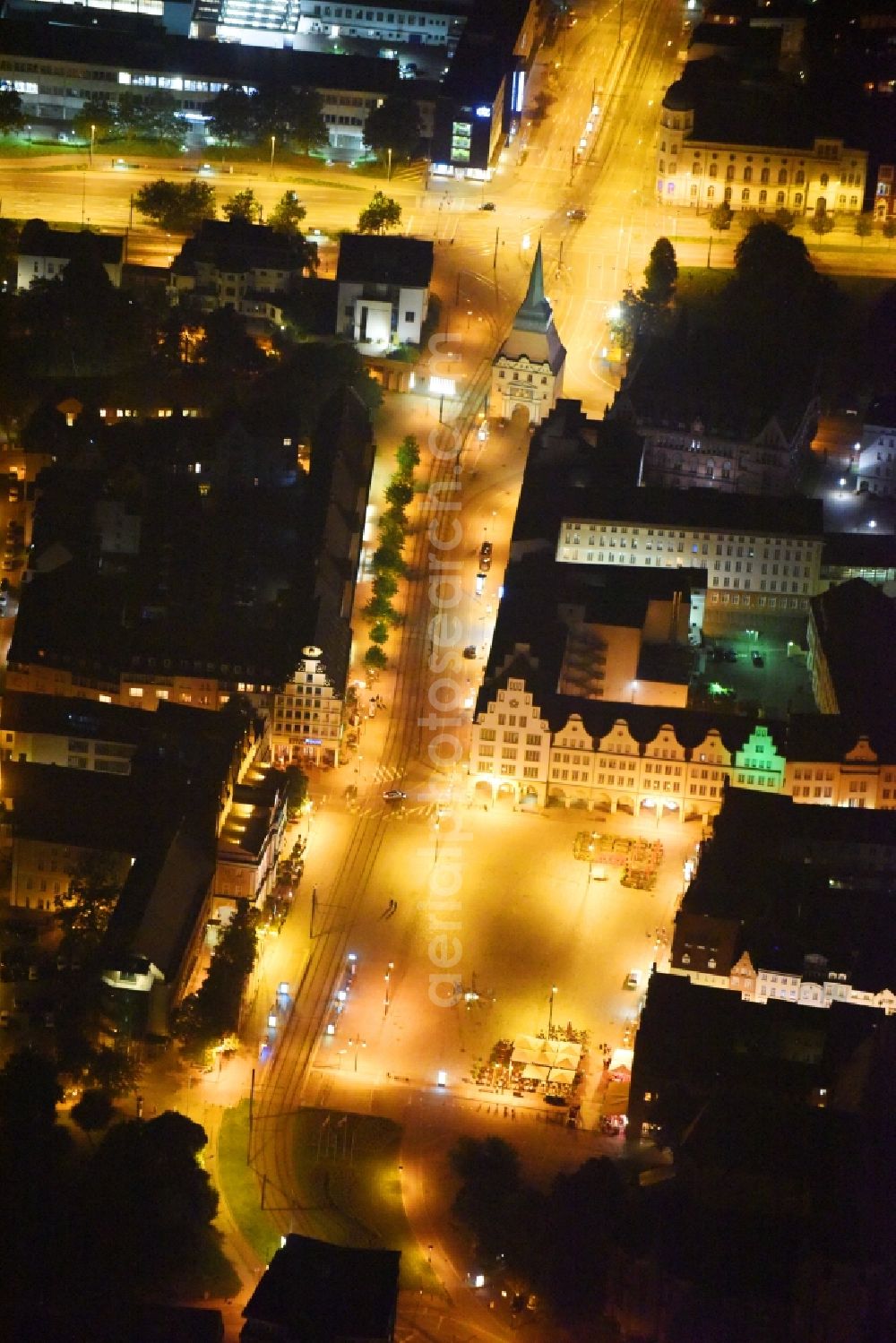 Aerial image at night Rostock - Night lighting Town Hall building of the city administration on Neuer Markt in Rostock in the state Mecklenburg - Western Pomerania, Germany