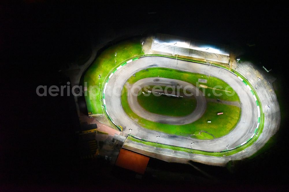 Güstrow at night from above - Night lighting Racetrack racecourse of MC Guestrow on Plauer Chaussee in the district Gleviner Burg in Guestrow in the state Mecklenburg - Western Pomerania, Germany