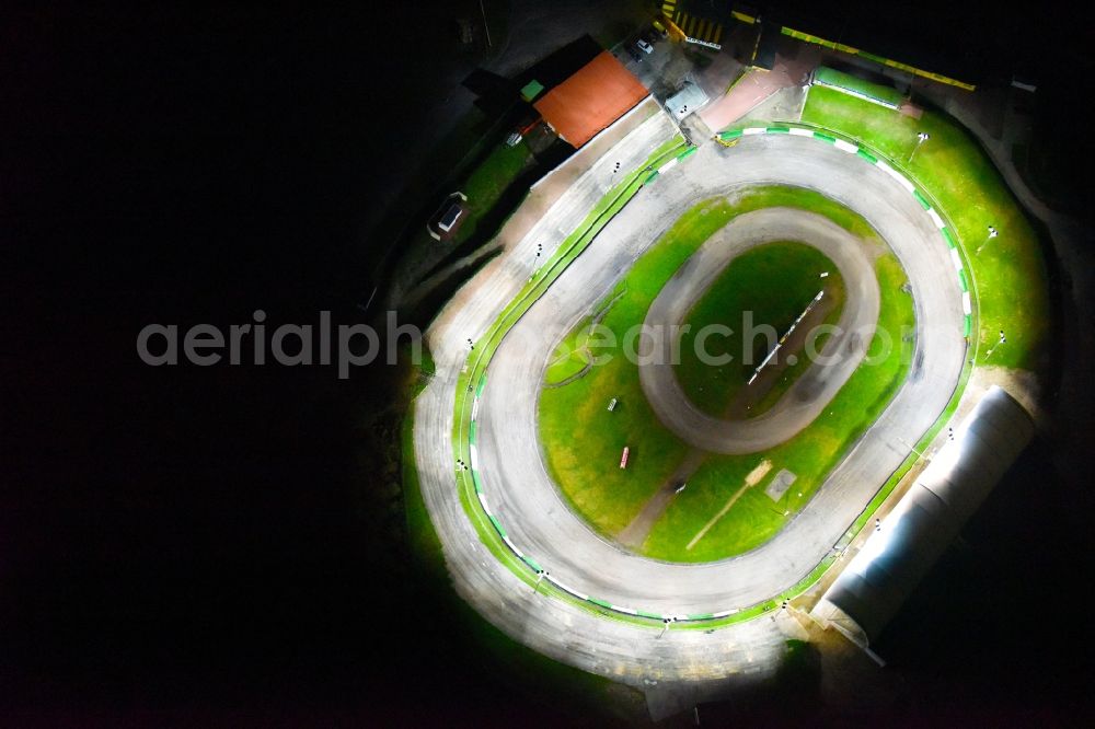 Güstrow at night from above - Night lighting Racetrack racecourse of MC Guestrow on Plauer Chaussee in the district Gleviner Burg in Guestrow in the state Mecklenburg - Western Pomerania, Germany