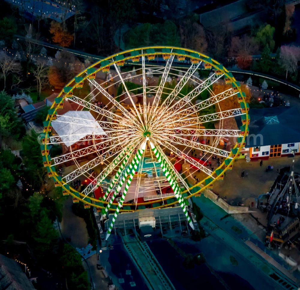 Rust at night from the bird perspective: Night lighting Giant Wheel in the Leisure Centre - Amusement Park Europapark in Rust in the state Baden-Wurttemberg, Germany