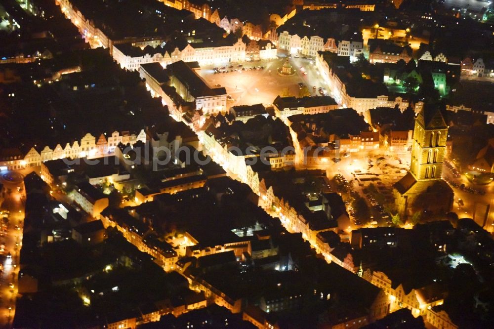 Wismar at night from the bird perspective: Night lighting Ruins of church building Marienkirche in Wismar in the state Mecklenburg - Western Pomerania, Germany