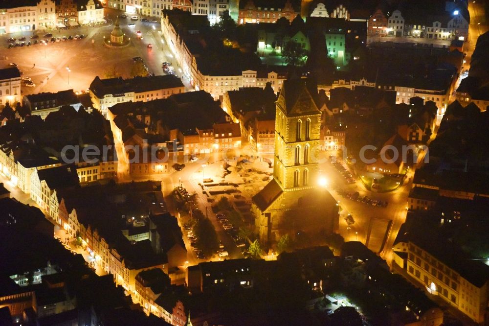 Aerial image at night Wismar - Night lighting Ruins of church building Marienkirche in Wismar in the state Mecklenburg - Western Pomerania, Germany