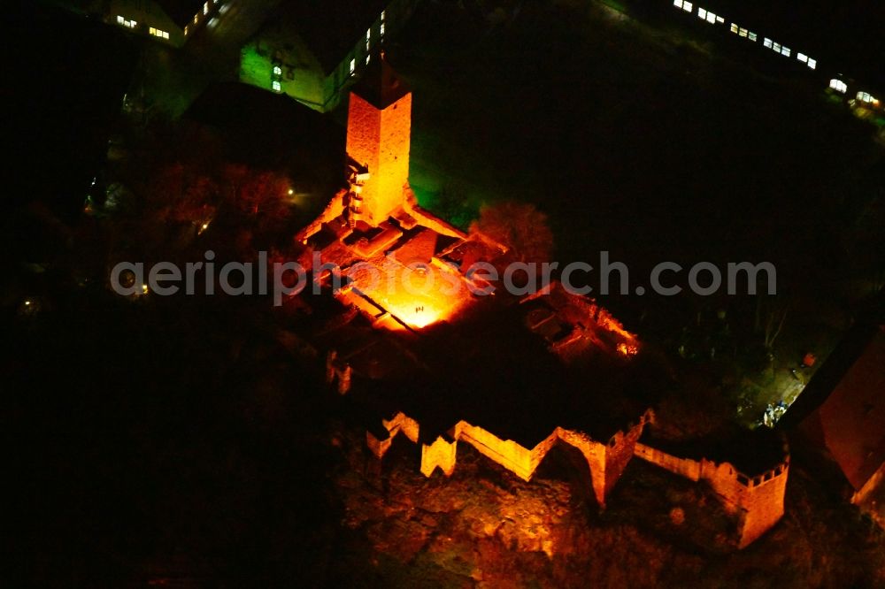 Aerial image at night Halle (Saale) - Night lighting Ruins and vestiges of the former castle and fortress Burg Giebichenstein on Seebener Strasse in Halle (Saale) in the state Saxony-Anhalt