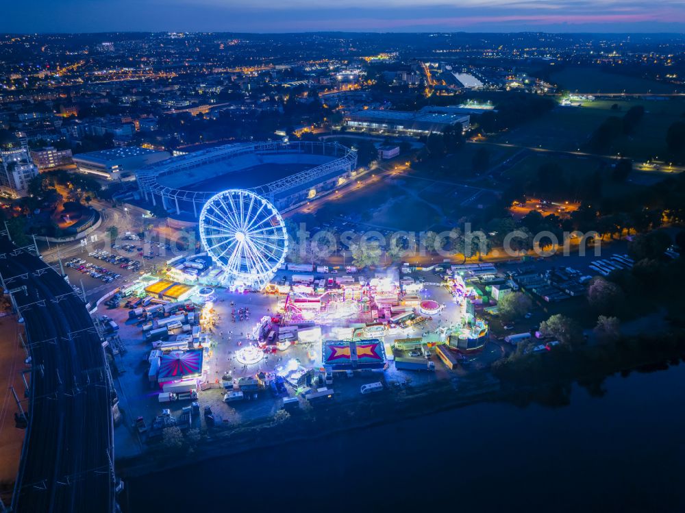 Aerial image at night Dresden - Night lighting Night lights and lighting Ferris wheel at the fairground on the folk festival grounds on Pieschener Allee in the district of Friedrichstadt in Dresden in the federal state of Saxony, Germany