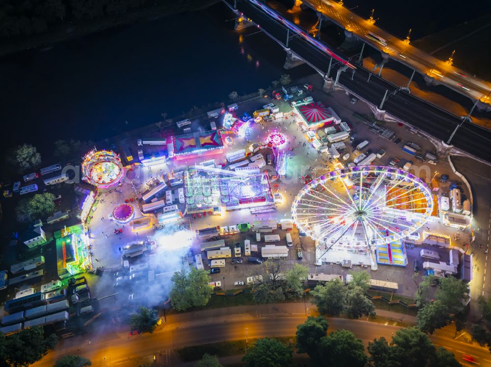 Dresden at night from above - Night lighting Night lights and lighting Ferris wheel at the fairground on the folk festival grounds on Pieschener Allee in the district of Friedrichstadt in Dresden in the federal state of Saxony, Germany