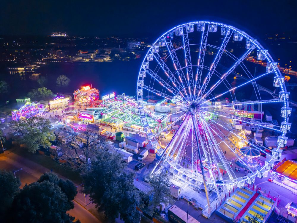 Dresden at night from above - Night lighting Night lights and lighting Ferris wheel at the fairground on the folk festival grounds on Pieschener Allee in the district of Friedrichstadt in Dresden in the federal state of Saxony, Germany