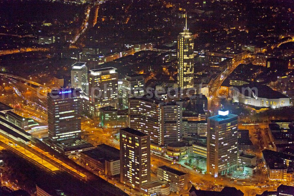 Essen at night from above - Nachtluftbild auf die RWE-Konzernzentrale in Essen. Der RWE-Turm bildet mit 120 m Höhe und 500 Arbeitsplätzen die Zentrale des Energieversorgers RWE. Das Hochhaus ist ökologische orientiert konzipiert und gewinnt natürliche Energie aus Tageslicht und Sonnenwärme. View of the RWE headquarters in Essen at night. The RWE Tower is with 120 meters and up to 500 workplaces the headquarter of the energy supplier RWE. The tower is designed ecological and gains energy from natural daylight and solar heat.