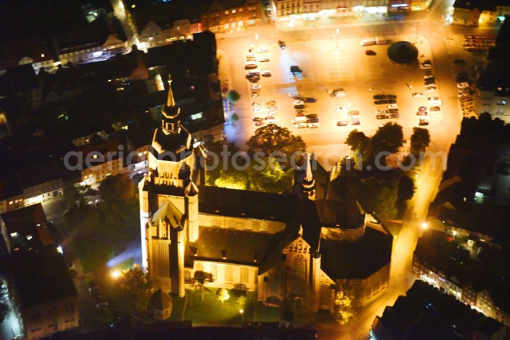 Aerial image at night Stralsund - Night lighting Saint Mary's Church in the city of Stralsund in Mecklenburg-Vorpommern