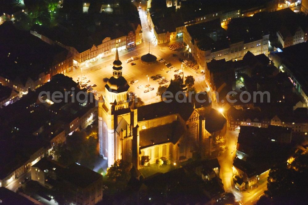 Aerial image at night Stralsund - Night lighting Saint Mary's Church in the city of Stralsund in Mecklenburg-Vorpommern