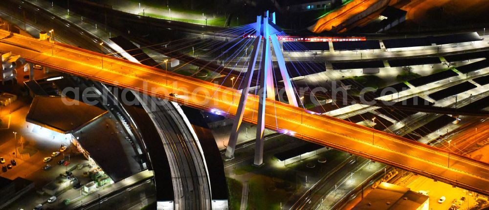 Ludwigshafen am Rhein at night from the bird perspective: Night lighting cable-stayed bridge road bridge construction along of federal street B37 in Ludwigshafen am Rhein in the state Rhineland-Palatinate, Germany