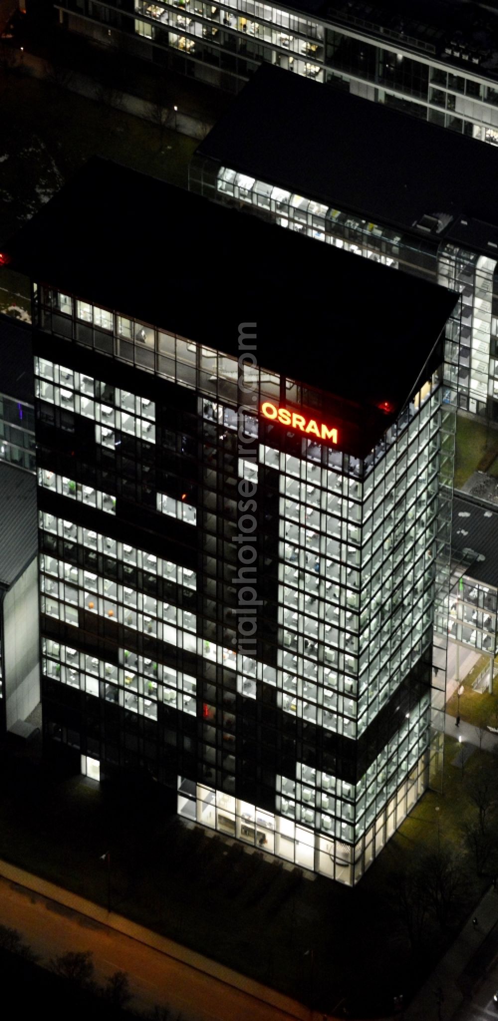 München at night from the bird perspective: Night lighting administration building of the company of OSRAM GmbH on Marcel-Breuer-Strasse in the district Schwabing-Freimann in Munich in the state Bavaria, Germany