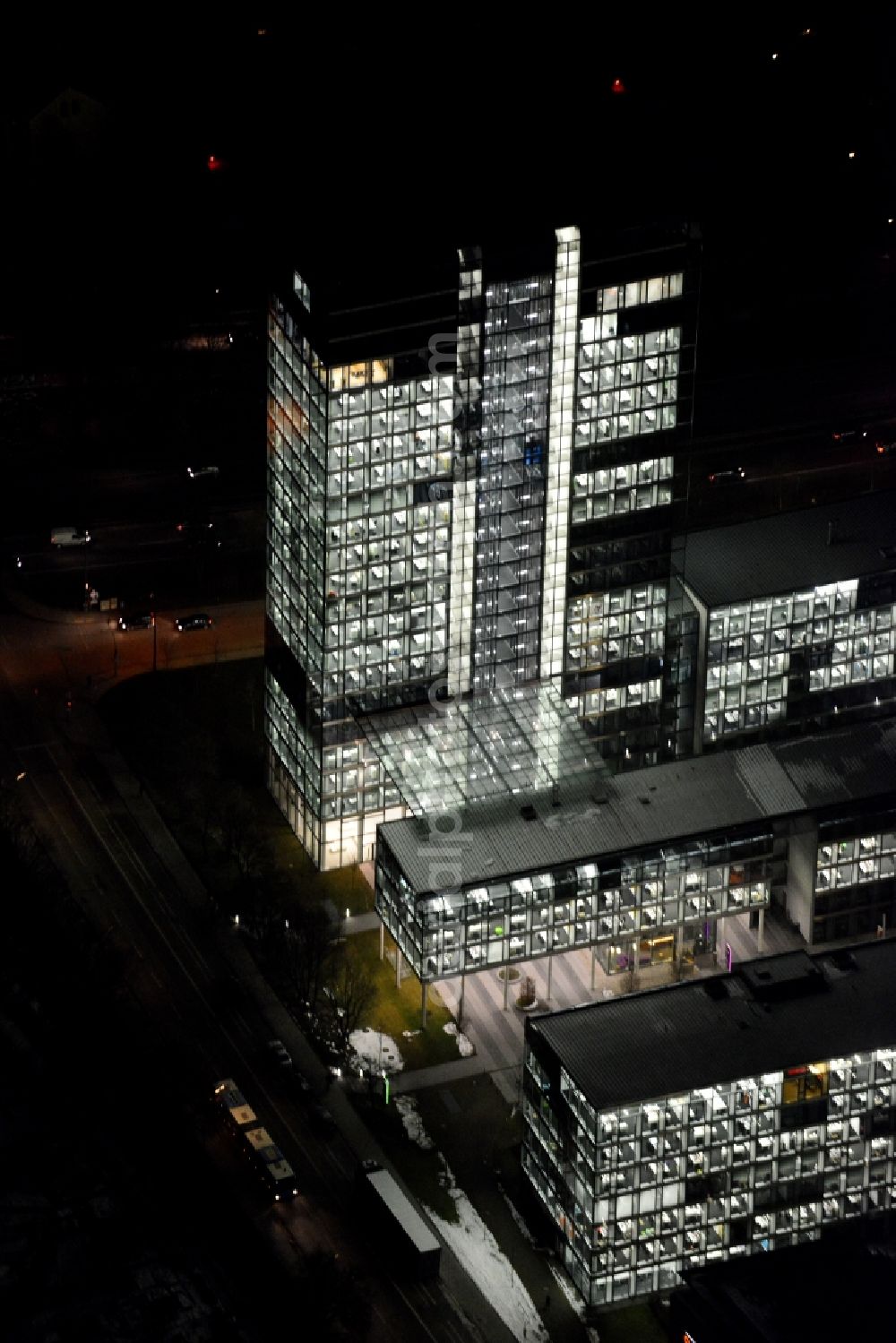 München at night from the bird perspective: Night lighting administration building of the company of OSRAM GmbH on Marcel-Breuer-Strasse in the district Schwabing-Freimann in Munich in the state Bavaria, Germany