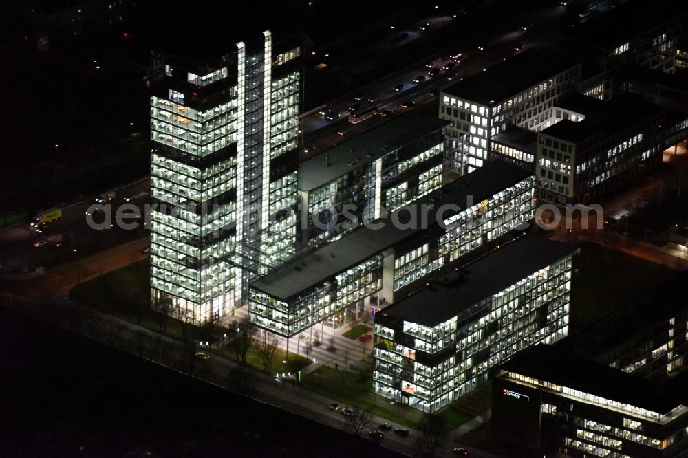 Aerial image at night München - Night lighting administration building of the company of OSRAM GmbH on Marcel-Breuer-Strasse in the district Schwabing-Freimann in Munich in the state Bavaria, Germany