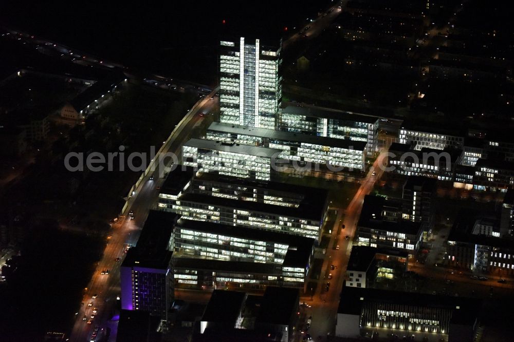 München at night from the bird perspective: Night lighting administration building of the company of OSRAM GmbH on Marcel-Breuer-Strasse in the district Schwabing-Freimann in Munich in the state Bavaria, Germany